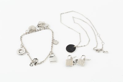Lot 106 - A paste set charm bracelet by Christian Dior,...