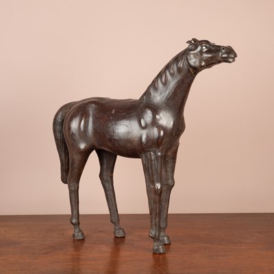 Lot 1030 - A Liberty & Co vintage leather covered wooden model of a horse