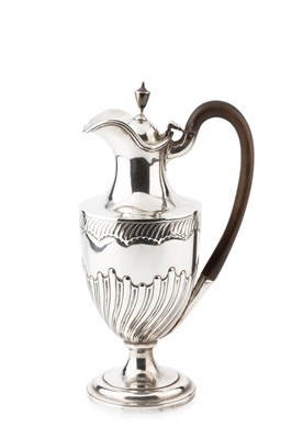 Lot 633 - A late Victorian silver hot water pot, of part-...