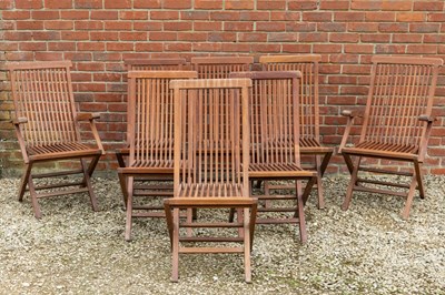 Lot 1285 - A set of eight teak folding garden chairs