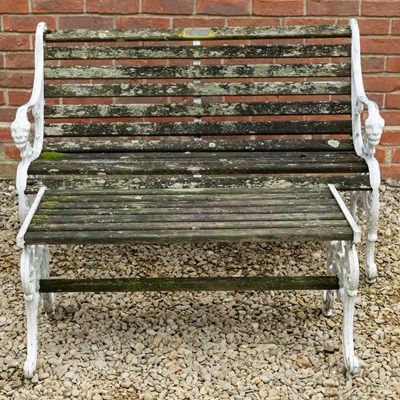 Lot 1242 - A garden bench and similar table