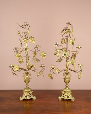 Lot 245 - A pair of gilt metal continental five-branch candelabra