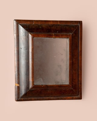 Lot 1173 - A 17th century oyster olive veneered cushion mirror