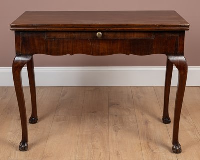 Lot 260 - A George III mahogany fold-over tea table