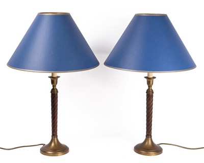 Lot 210 - A pair of oak and brass table lamps