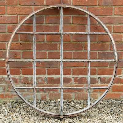 Lot 1215 - A circular cast iron window frame