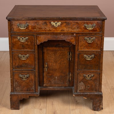 Lot 407 - An 18th century walnut kneehole desk