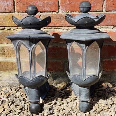 Lot 1353 - A pair of lead wall mounted lanterns