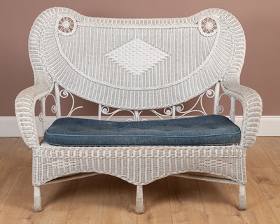 Lot 1362 - A white painted wickerwork two seater conservatory sofa