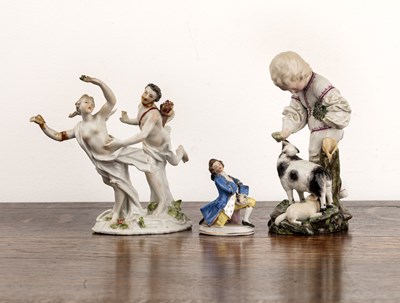 Lot 338 - Three porcelain figure groups the first of a...