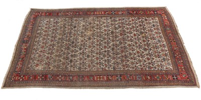 Lot 446 - An early 20th century Heriz style rug