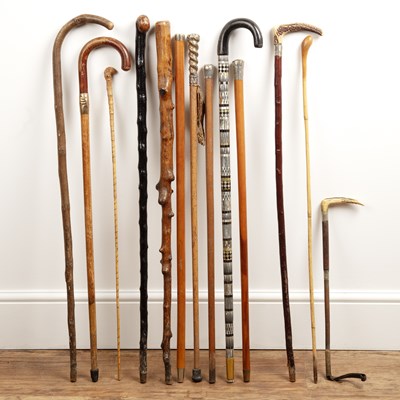 Lot 57 - Group of walking sticks and canes including...