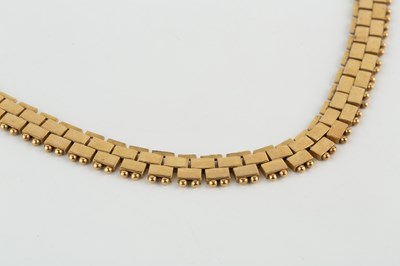Lot An 18ct gold necklace, composed of flattened...