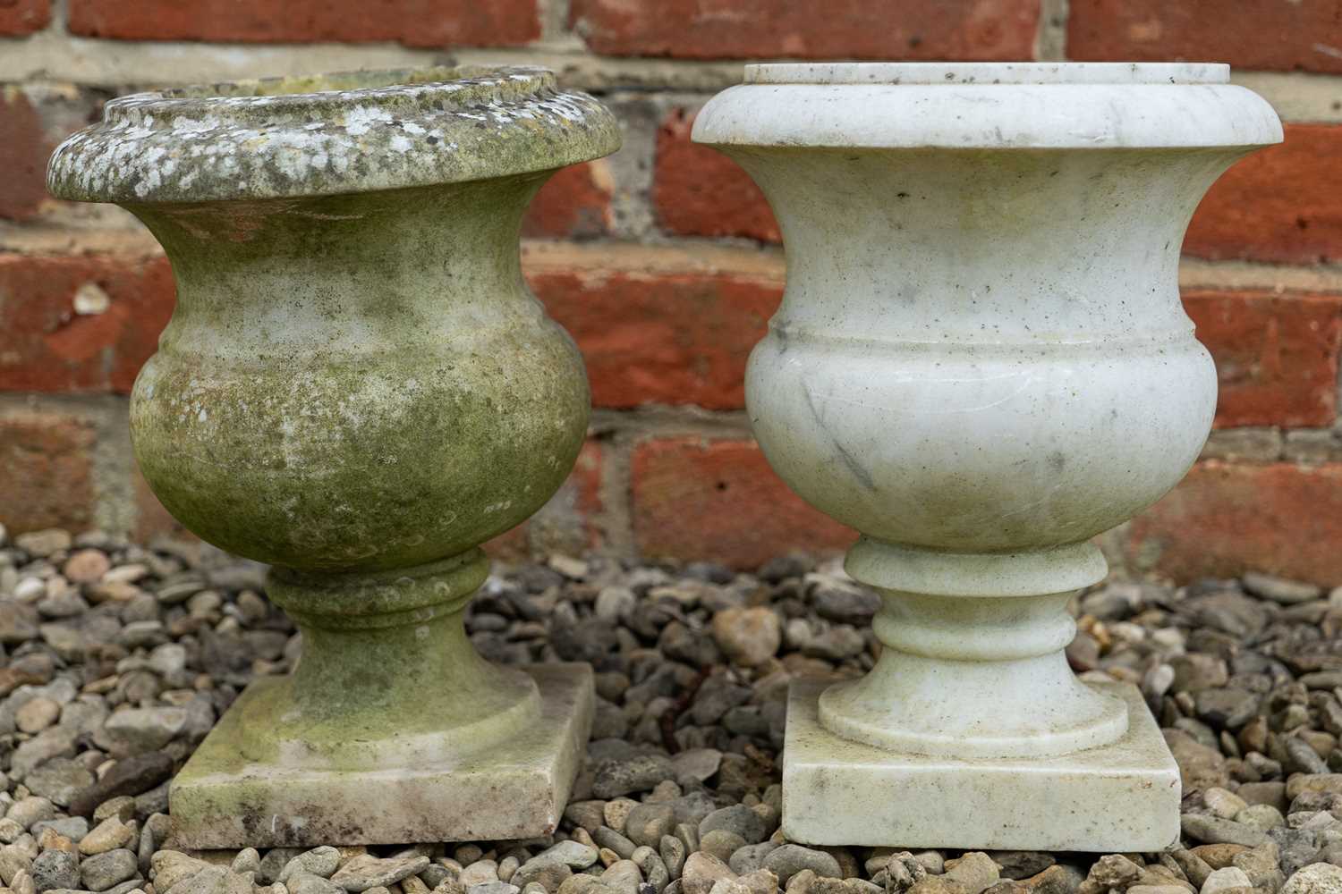 Lot 1233 - Two similar marble urns