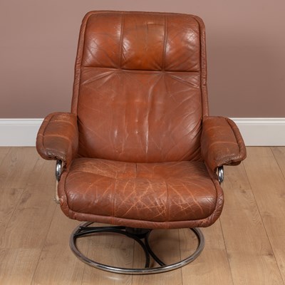 Lot 1070 - A leather and chrome reclining armchair