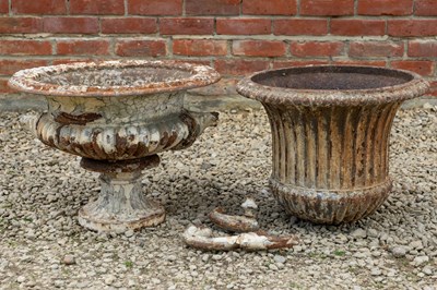 Lot 1201 - An antique cast iron urn and further urn sections