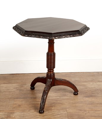 Lot 50 - Mahogany carved octagonal tip-up table...