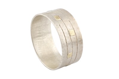 Lot 227 - A silver bangle by Breon O'Casey, the linear...