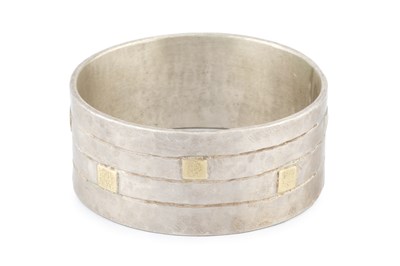 Lot 227 - A silver bangle by Breon O'Casey, the linear...