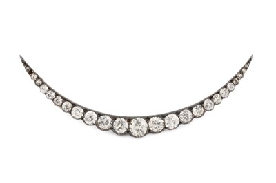 Lot 83 - A diamond crescent brooch, inset with...