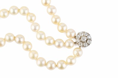 Lot 132 - A cultured pearl necklace with diamond set...