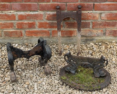 Lot 1332 - A group of three various old cast iron boot scrapers