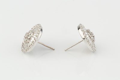 Lot 259 - A pair of diamond cluster ear studs, each...