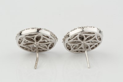 Lot 259 - A pair of diamond cluster ear studs, each...