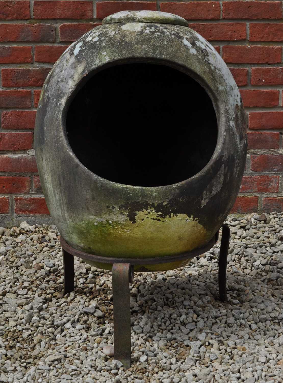 Lot 1329 - A terracotta chiminea type patio warmer