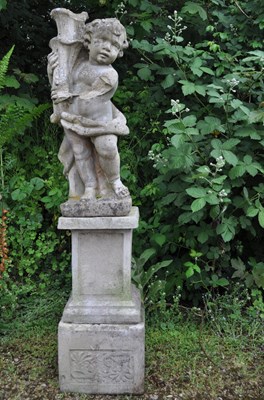 Lot 1230 - A cast reconstituted stone statue of a boy