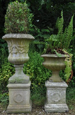 Lot 1302 - Two garden urns and two plinths