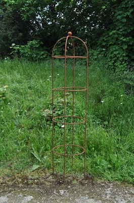 Lot 1317 - A hand forged wrought iron plant support of cylindrical form