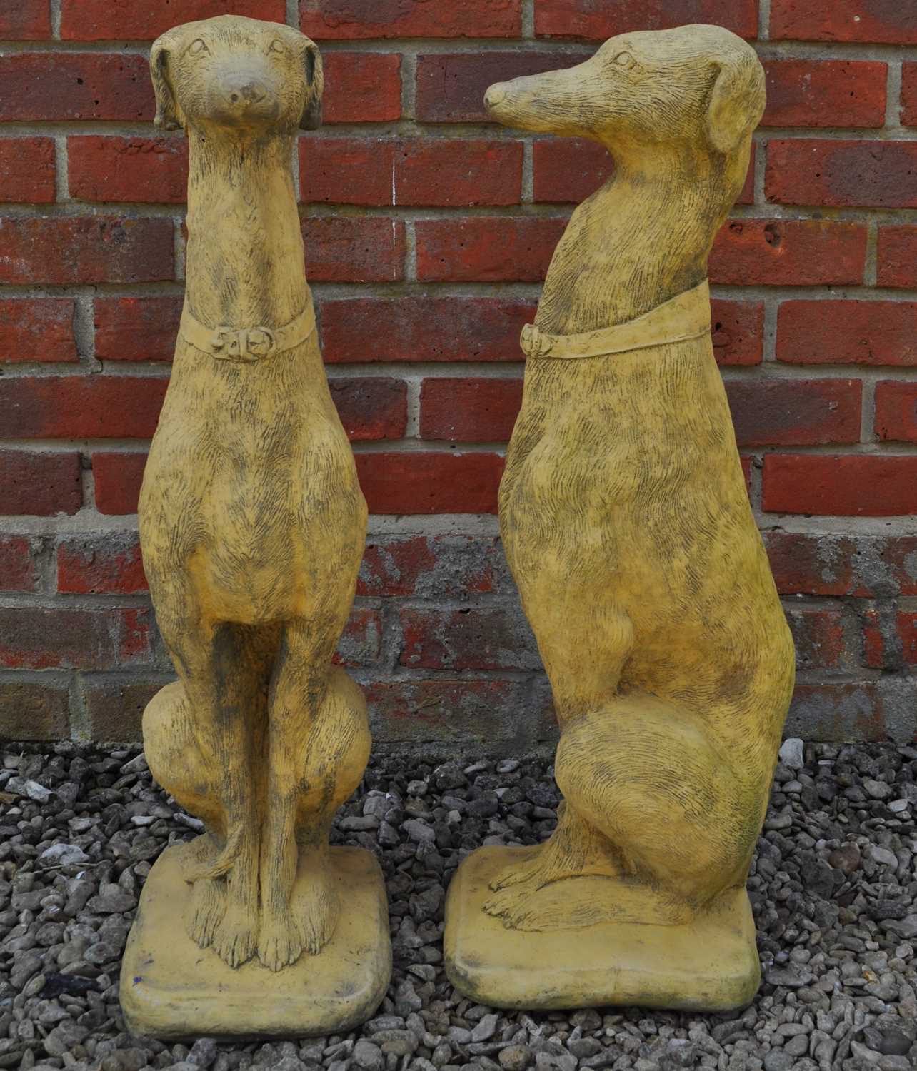 Lot 1495 - A pair of seated whippet garden sculptures