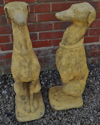 Lot 1495 - A pair of seated whippet garden sculptures