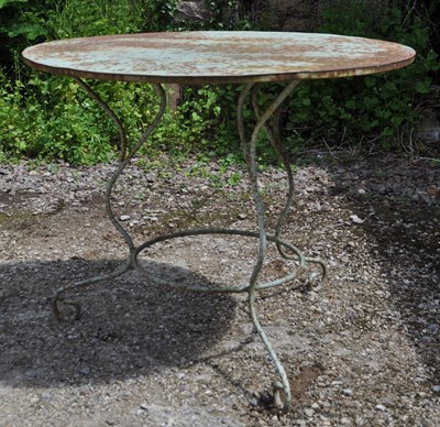 Lot 1265 - A French circular wrought iron garden table