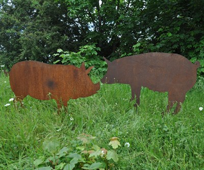 Lot 1277 - Two wrought iron pig silhouette ornaments