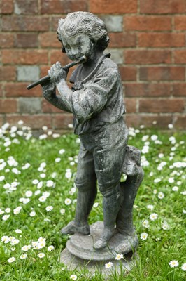 Lot 1259 - An antique lead sculpture in the form of a boy playing a flute