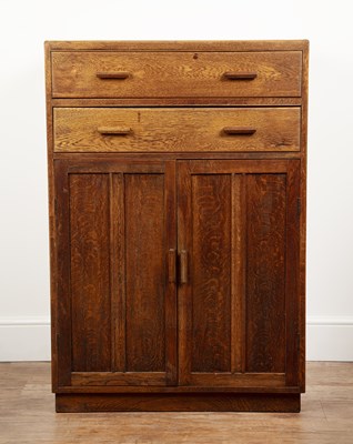 Lot 84 - In the manner of Heals oak, cupboard or...