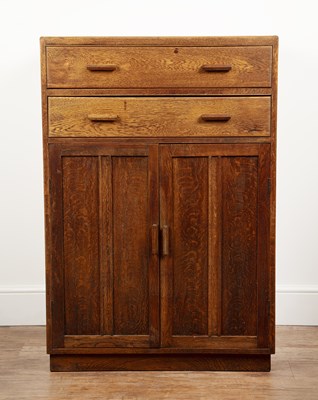 Lot In the manner of Heals oak, cupboard, with two...