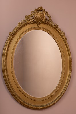 Lot 348 - An antique oval gilt framed wall mirror