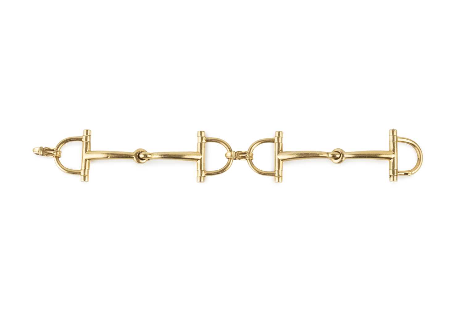 Lot A snaffle-link bracelet by Hermès, the jointed...