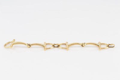 Lot 254 - A snaffle-link bracelet by Hermès, the jointed...