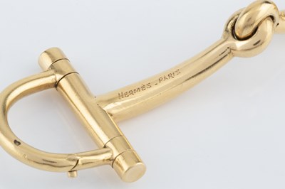Lot 254 - A snaffle-link bracelet by Hermès, the jointed...