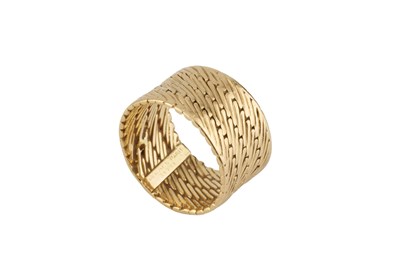 Lot 253 - A dress ring by Hermès, the wide band of...