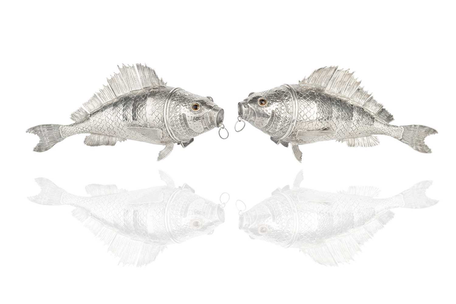 Lot A pair of Continental silver articulated fish...