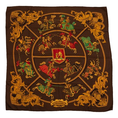 Lot 580 - A ‘Chevalerie’ silk scarf by Hermès, designed...