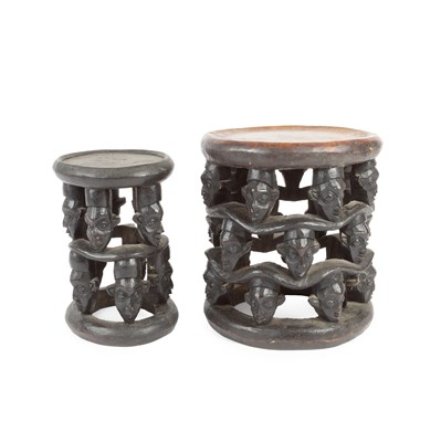 Lot 1054 - Two African tribal style carved stools