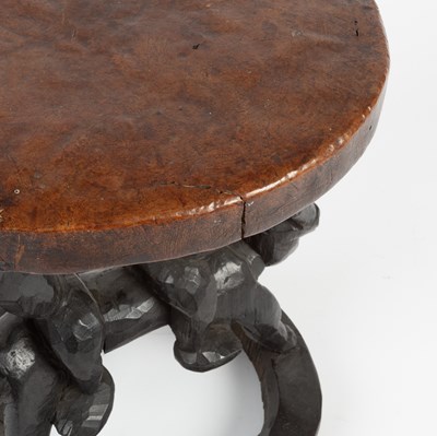 Lot 1027 - An African carved wooden tribal style stool