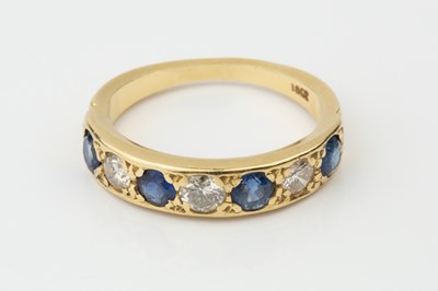 Lot A sapphire and diamond seven stone ring, the...