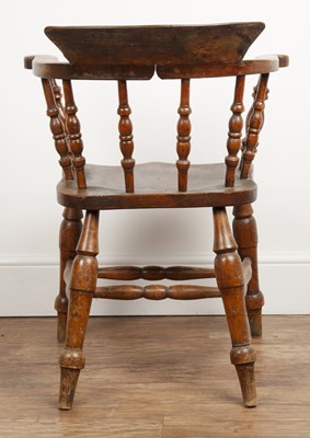 Lot 43 - Elm and ash smokers bow armchair Victorian,...